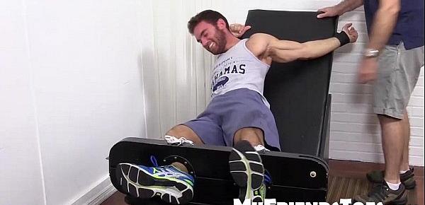  Hot brunette hunk tied up and getting foot tortured for fun